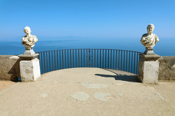 Stone statues on sunny Terrace of Infinity in Villa Cimbrone above the sea in Ravello, Amalfi Coast, Italy.