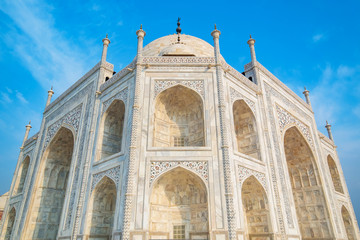 Fototapeta na wymiar Taj Mahal on a sunny day. An ivory-white marble mausoleum on the south bank of the Yamuna river in Agra, Uttar Pradesh, India. One of the seven wonders of the world.