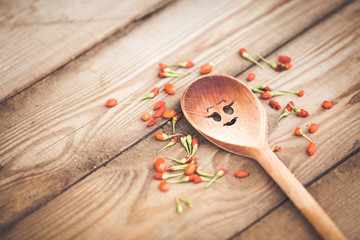 Goji fruits on wooden background
