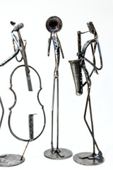 Creative figures of musicians, contrabass, sax and trumpet are playing together