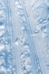 Ski track on snow. Ski tracks. Two ski tracks.