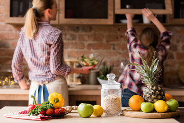 healthy food. organic natural vegetables fruit fresh orange juice and oatmeal. balanced nutrition. wholesome meal cooking.