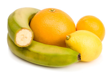 Banana and lemons isolated on white background