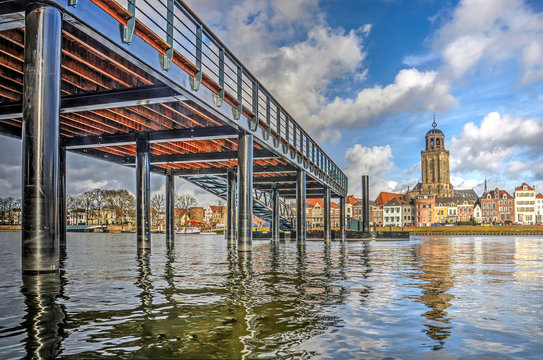 Low view across the IJssel river towards the city of Deventer, The Netherlands and the new ferry pier, constructed on the location of the historic pontoon bridge