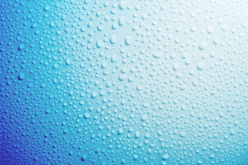 Water droplets on blue background.