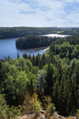 Fototapeta na wymiar Scenic view of a lake and forests from Aulanko lookout tower in Hämeenlinna, Finland, in the summer.