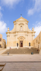 Fototapeta na wymiar Victoria, the island of Gozo, Malta. Facade of the Cathedral of Santa Maria in the Citadel