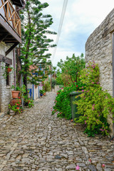 Fototapeta na wymiar Narrow cobbled street in the village of Lania, Cyprus