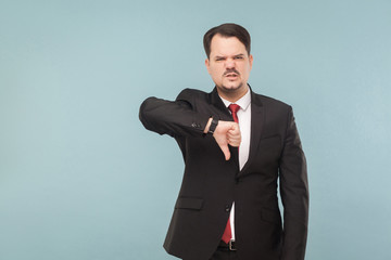 No, it's bad idea, realy. Business man showing dislike, fail sign. indoor studio shot. isolated on...