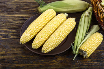 sweet corn on a wooden background