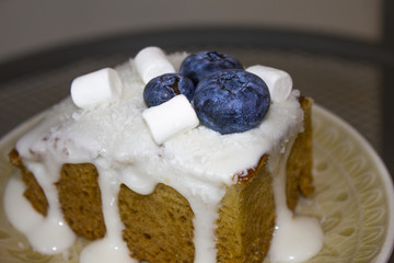 homemade honey carrot cake with blueberries and cream cheese
