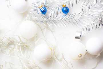 Christmas blur background. flat lay. garland, silver decorations, white balls - holidays, winter and celebration concept