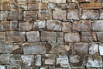 Old grunge natural stone wall.