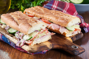 Toasted sandwiches with ham, cheese and vegetables