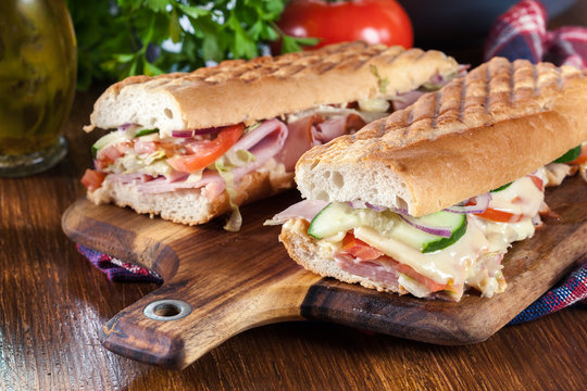 Toasted sandwiches with ham, cheese and vegetables