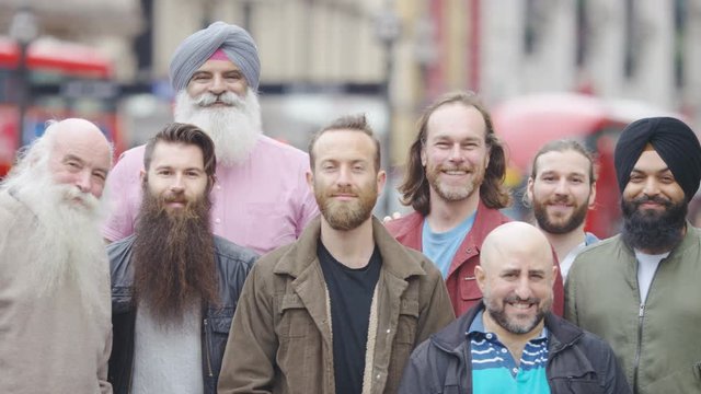 Portrait of a group of men in the city with beards looking to camera