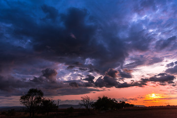 Dramatic clouds on the sky at the sunset