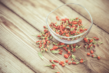 Goji fruits on wooden background
