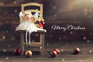 Merry Christmas card with an angel holding Christmas star. Christmas card concept - Powered by Adobe