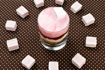 Muesli with yogurt and fresh  strawberry and marshmallow. Tasty dessert on breakfast.