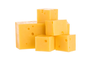 Heap of cheese cubes isolated on white background. With clipping path.