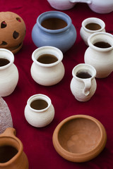 Clay vessels of handwork of various shapes and colors. Articles of pottery