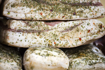 Salted fat flavored with spices