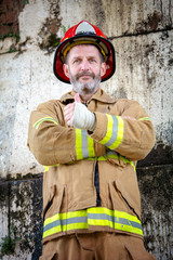Fototapeta premium handsome fireman in uniform with thumbs up