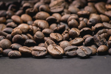 Close up of coffee beans are the background.