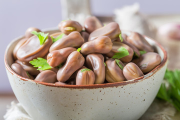 Closeup of delicious broad beans in old white kitchen