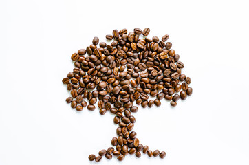 Roasted coffee beans pile on white background a view from the top.