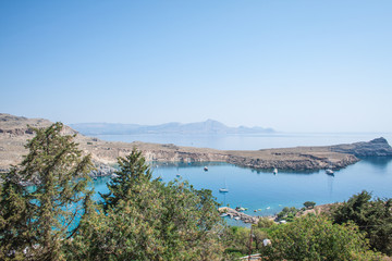 Fototapeta na wymiar view of lindos harbor from acropolis on rhodes island