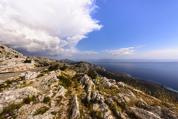 Fototapeta na wymiar View of the rocky Dalmatian coast and the Adriatic Sea from Sveti Jure peak, Biokovo Nature Park, Croatia