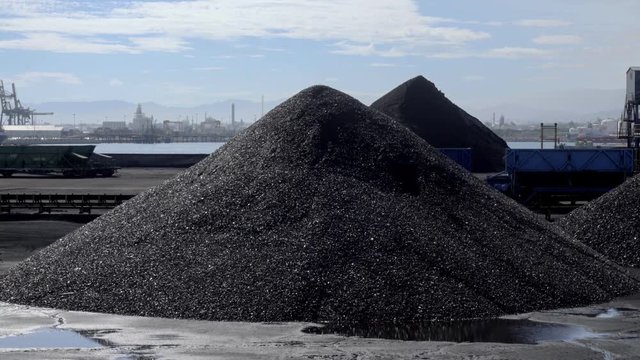Large Stockpile of Coal in Tarragona port terminal.Air pollution from coal-fired power plants is linked with severe environmental and public health impacts.