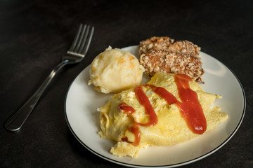 Egg-covered rice with textured background