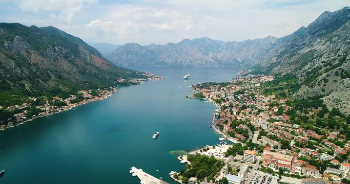Aerial beautiful View of Kotor bay. Cruise ship docked in beautiful summer day. View of kotor old town from Lovcen mountain in Kotor, Montenegro. Kotor is part of the unesco world.