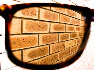 house brick wall glasses 1