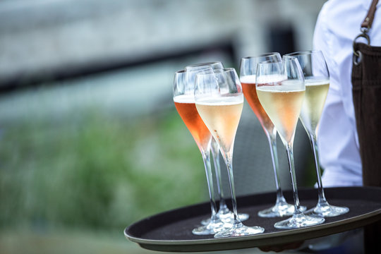 Waiter Carries Wine On Tray