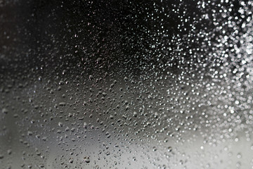 water drop on glass when raining for bakcground.