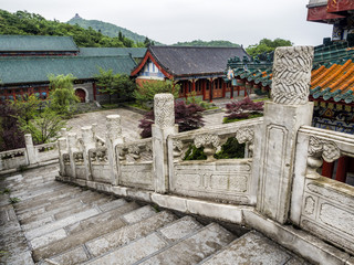 Buddhist Temple with colorful decorative details at the top of the Tianmen Mountain, Hunan Province, Zhangjiajie, China