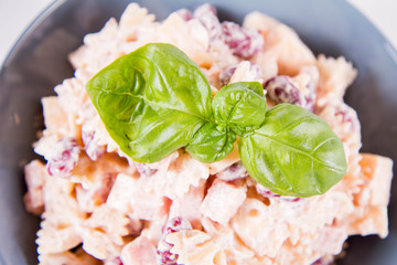 Pasta salad with cheese, ham, kidney beans and mayonnaise