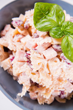 Pasta salad with cheese, ham, kidney beans and mayonnaise 