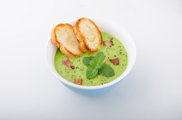 Pea soup, fresh herbs and bacon