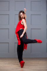 Girl dancing hip hop over white background.