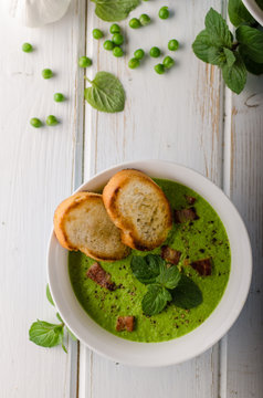 Pea soup, fresh herbs and bacon