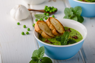 Pea soup, fresh herbs and bacon