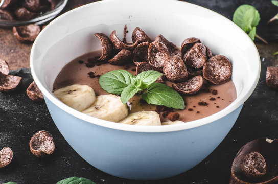 Chocolate pudding, banana and herbs in