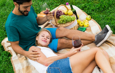 Fototapeta premium Woman is lying on the lap of boyfriend in time picnic