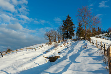 Winter  morning mountain rural snow covered path