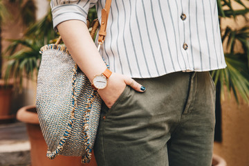 street style fashion details. close up, woman wearing a summer shirt and a white and brown analog...